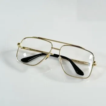 Gold Frame Sunglasses – Premium Minimal Style Product Description Keep your look clean and refined with these gold frame sunglasses. The smooth gold finish adds a soft shine that feels premium yet simple. The lenses help reduce harsh sunlight and keep your eyes comfortable outdoors. You get clear vision without strain. The frame feels light and sits well on your face, making it easy to wear for long hours. Perfect for daily use, travel, or outdoor plans. This pair is all about effortless style. It blends easily with both casual and classy outfits while adding a subtle luxe touch. Key Features Model: 001 Full gold metal frame UV-protection lenses for sun safety Lightweight and durable build Comfortable all-day fit Unisex modern design Why Choose These Sunglasses Clean and premium gold look Light and easy to wear Comfortable for long use Matches multiple outfit styles Styling Tips Pair it with white, beige, or neutral outfits for a fresh and polished look. Works well with both casual and semi-formal styles. Popular Searches gold frame sunglasses, premium gold sunglasses, stylish UV sunglasses, metal frame shades, unisex fashion sunglasses, daily wear sunglasses Occasion Fit Casual wear, Travel, Day outings, Outdoor events