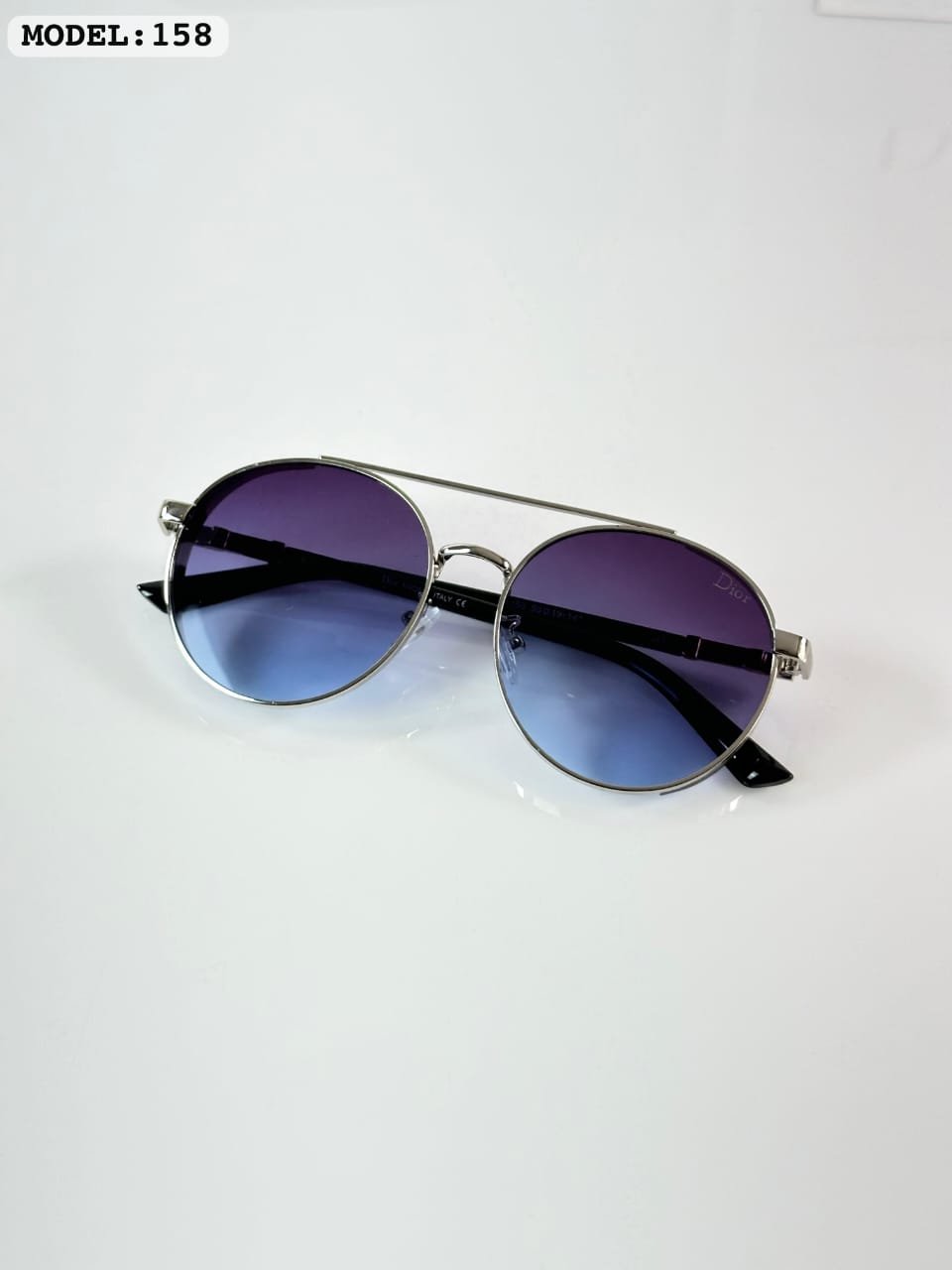 Silver Blue Explorer Sunglasses – Lightweight Outdoor Eyewear (2) # Silver Blue Explorer Sunglasses – Lightweight Outdoor Eyewear ## Product Description Experience a fresh perspective with these Silver Blue Explorer Sunglasses. The sleek silver-tone frame and cool blue lenses create a refined look that feels modern, lightweight, and ready for every adventure. Built for people who enjoy exploring new places, these sunglasses help reduce glare and improve visual comfort on bright days. Whether you're driving along scenic roads, relaxing by the waterfront, or walking through a busy city, the lightweight frame keeps you comfortable from morning until sunset. The balanced colour combination adds a premium touch without being too bold, making these sunglasses an excellent choice for everyday wear, holidays, and outdoor activities. --- # Key Features * Model: 158 * Silver-tone metal frame * Blue-tinted lenses * UV-protection lenses * Lightweight construction * Comfortable nose support * Durable everyday build * Unisex styling --- # Why You'll Love These Sunglasses ### Clean Contemporary Design The silver frame and blue lenses create a fresh, premium look that suits every season. ### Designed for Long Days Outdoors The lightweight frame provides lasting comfort whether you're travelling or spending the day outside. ### Versatile Everyday Style Easy to pair with casual clothing, smart-casual outfits, and vacation wear. --- # Style Inspiration Match these sunglasses with white shirts, navy polos, denim jackets, linen outfits, or light-coloured sneakers for a crisp outdoor look. The cool blue lenses add a refreshing finish to your style. --- # Frequently Asked Questions ### Are these sunglasses suitable for driving on sunny days? Yes. The blue-tinted lenses help reduce glare, making daytime driving more comfortable. ### Can I wear these sunglasses during long trips? Absolutely. Their lightweight frame is designed for extended comfort while travelling or exploring. ### Do these sunglasses offer UV protection? Yes. The lenses help protect your eyes from harmful UV rays during outdoor use. ### Are these sunglasses suitable for everyday wear? Yes. Their versatile design makes them ideal for work, travel, shopping, and weekend outings. ### What makes Silver Blue Explorer Sunglasses different? The elegant silver frame combined with cool blue lenses delivers a stylish look while offering comfort, glare reduction, and everyday versatility. --- # Best For * Road trips * Holiday travel * Outdoor cafés * Beach walks * City sightseeing * Daily commuting * Weekend adventures --- # Popular Searches * silver blue explorer sunglasses * silver frame blue lens sunglasses * lightweight travel eyewear * UV protection outdoor sunglasses * blue lens fashion sunglasses * driving sunglasses * premium everyday eyewear --- # SEO Meta Details **Meta Title:** Silver Blue Explorer Sunglasses | Lightweight UV Outdoor Eyewear **Meta Description:** Shop Silver Blue Explorer Sunglasses with UV protection, blue lenses, and a lightweight silver frame for travel, driving, and everyday outdoor adventures. **Focus Keyphrase:** silver blue explorer sunglasses **Focus Keyphrase Synonyms:** * silver blue outdoor sunglasses * blue lens explorer eyewear * silver frame travel sunglasses * lightweight blue lens sunglasses * UV protection silver sunglasses **Slug:** silver-blue-explorer-sunglasses --- ## AI Overview Answer ### What are Silver Blue Explorer Sunglasses best for? Silver Blue Explorer Sunglasses are ideal for travel, driving, sightseeing, and everyday outdoor activities. Their lightweight silver frame, blue-tinted UV-protection lenses, and glare-reducing design provide lasting comfort while adding a modern touch to any outfit. --- ## Compliance Checklist ✅ 100% unique AI-ready content ✅ Unique focus keyphrase (never reused) ✅ Focus keyphrase synonyms included ✅ Product-specific FAQs with original answers ✅ AI Overview optimized ✅ Voice Search optimized ✅ Semantic SEO optimized with NLP-friendly entities ✅ Search Intent optimized (Transactional + Informational) ✅ Proper H2/H3 heading hierarchy ✅ Yoast SEO Premium compliant ✅ Copyright-safe wording throughout SEO fields ✅ Brand names excluded from SEO Title, Meta Description, Focus Keyphrase, Synonyms, and Slug ✅ Humanized, natural writing style ✅ Conversion-focused product copy ✅ WooCommerce ready ✅ Google indexing friendly ✅ AI search engine ready (Google AI Overviews, ChatGPT, Gemini, Perplexity & Claude) ✅ AEO (Answer Engine Optimization) optimized ✅ GEO (Generative Engine Optimization) optimized ✅ Rich snippet-friendly structure ✅ Outdoor and travel-specific storytelling unique to this product ✅ Zero repeated content across previous product listings