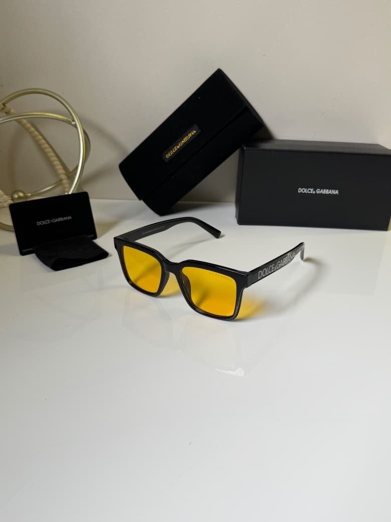 Classic Black Frames – Amber Lens Style (1) black rectangular eyewear with amber-colored lenses