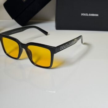 black rectangular eyewear with amber-colored lenses