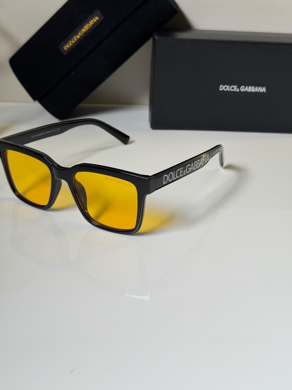Classic Black Frames – Amber Lens Style (2) black rectangular eyewear with amber-colored lenses