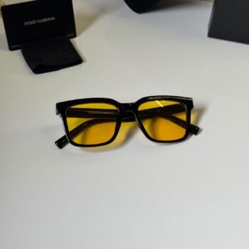 black rectangular eyewear with amber-colored lenses