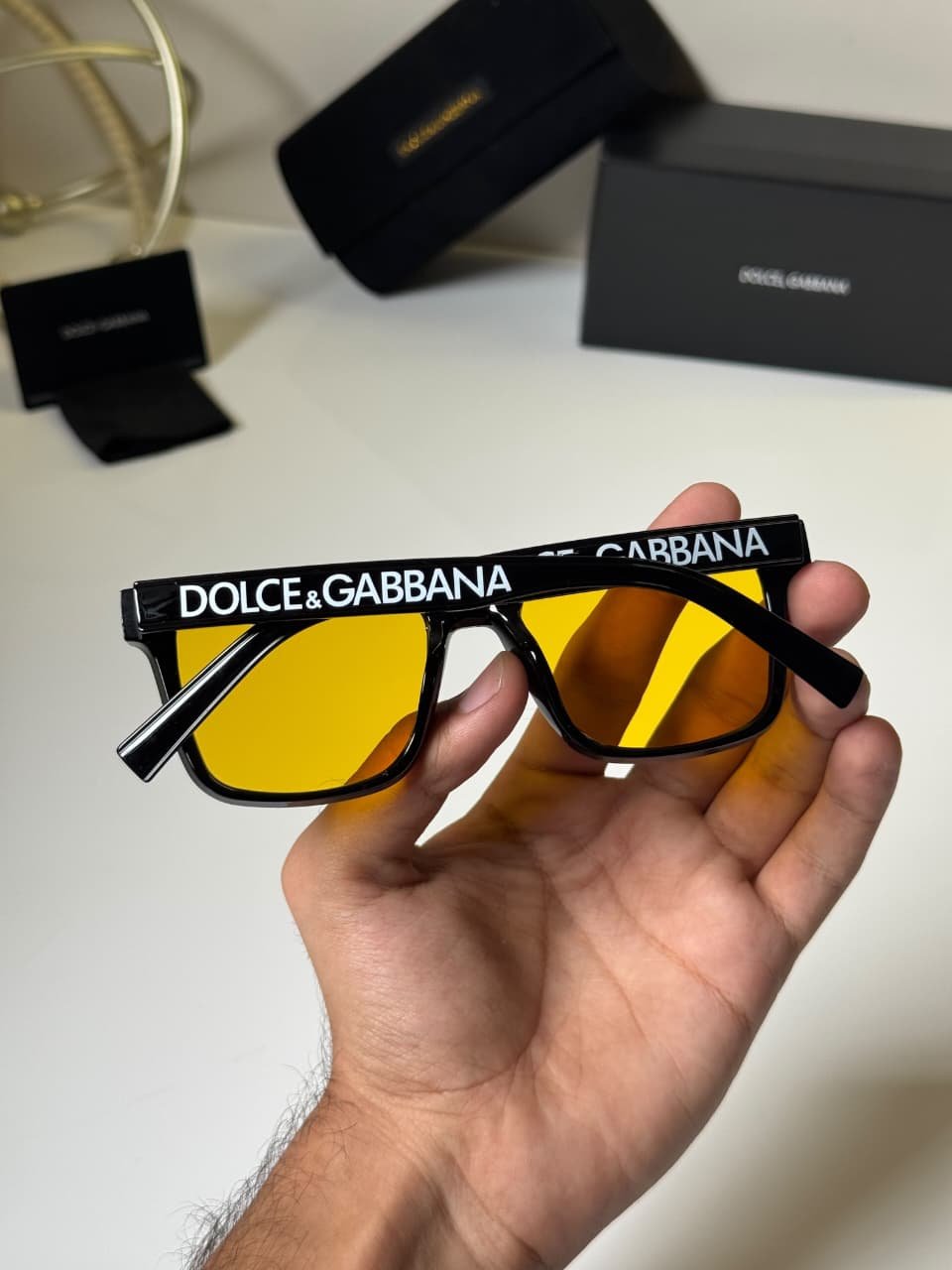 Classic Black Frames – Amber Lens Style (4) black rectangular eyewear with amber-colored lenses