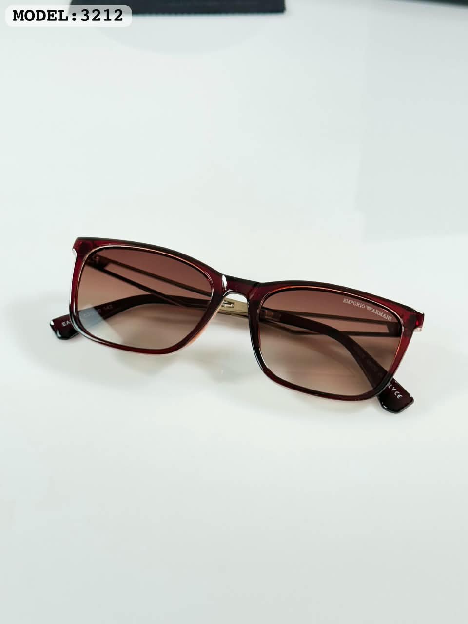 Brown Frame Sunglasses – Gold Tone Details (3) Brown rectangular sunglasses with gradient-style lenses and gold-tone temples