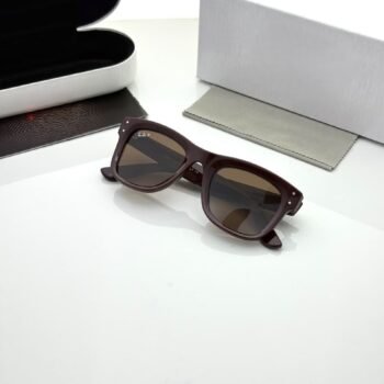 Dark brown rectangular sunglasses with brown tinted lenses and broad temples