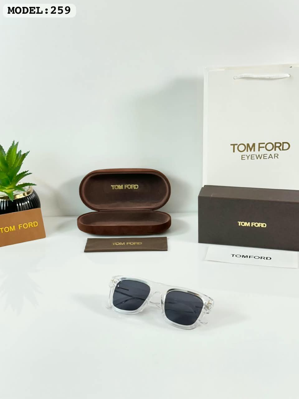 Clear Frame Sunglasses – Black Tinted Lenses (1) Clear frame sunglasses with rectangular black tinted lenses and transparent temples