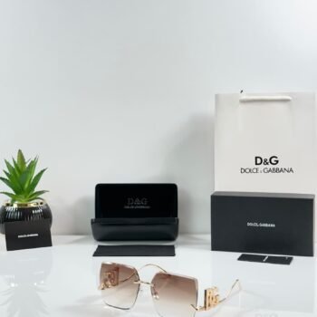 Rimless square sunglasses with gold-tone metal details and brown gradient lenses