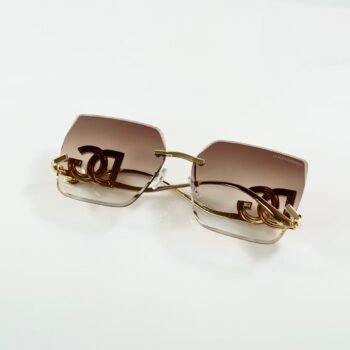 Rimless square sunglasses with gold-tone metal details and brown gradient lenses