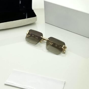 Rimless square sunglasses with gold-tone metal details and shaded grey-brown lenses