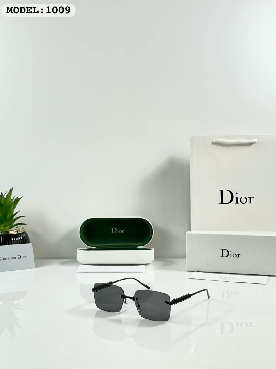 Rimless Sunglasses – Black Lenses with Textured Temples (1) Black rimless rectangular sunglasses with dark lenses and textured temples