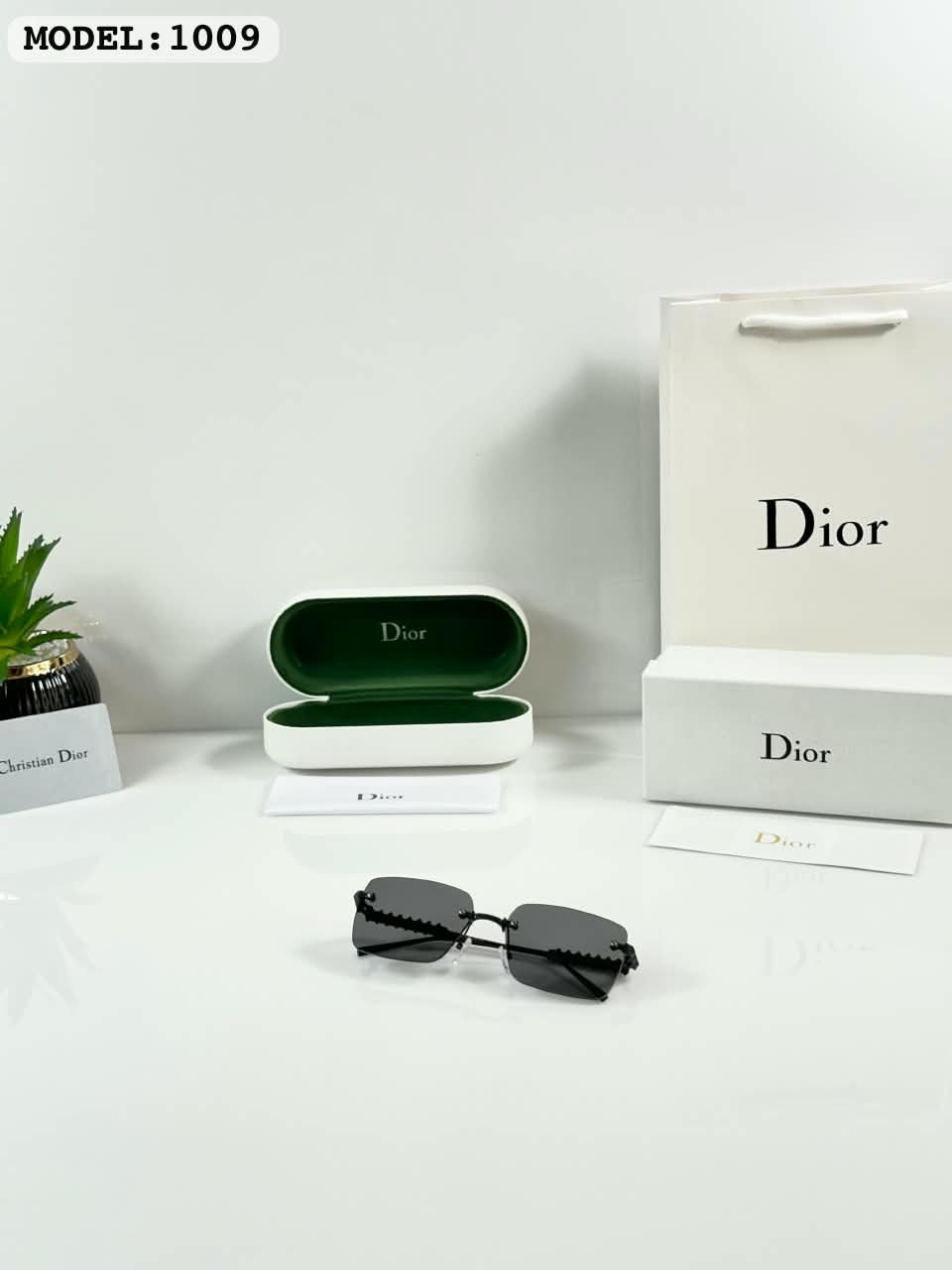 Rimless Sunglasses – Black Lenses with Textured Temples (2) Black rimless rectangular sunglasses with dark lenses and textured temples