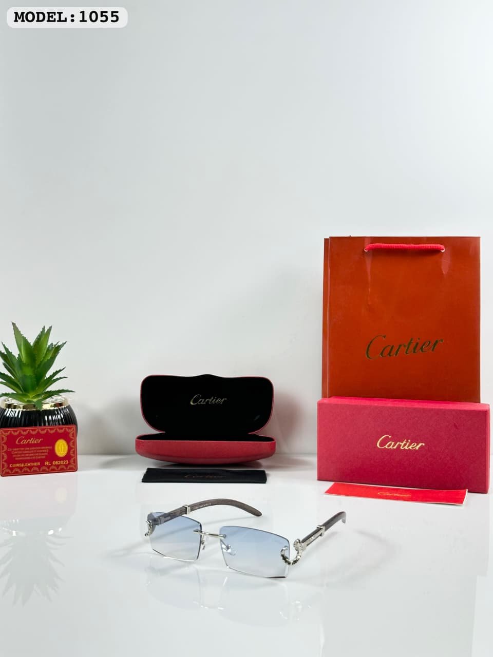 Silver Rimless Sunglasses – Blue Gradient Lenses (2) Silver rimless sunglasses with rectangular light blue tinted lenses