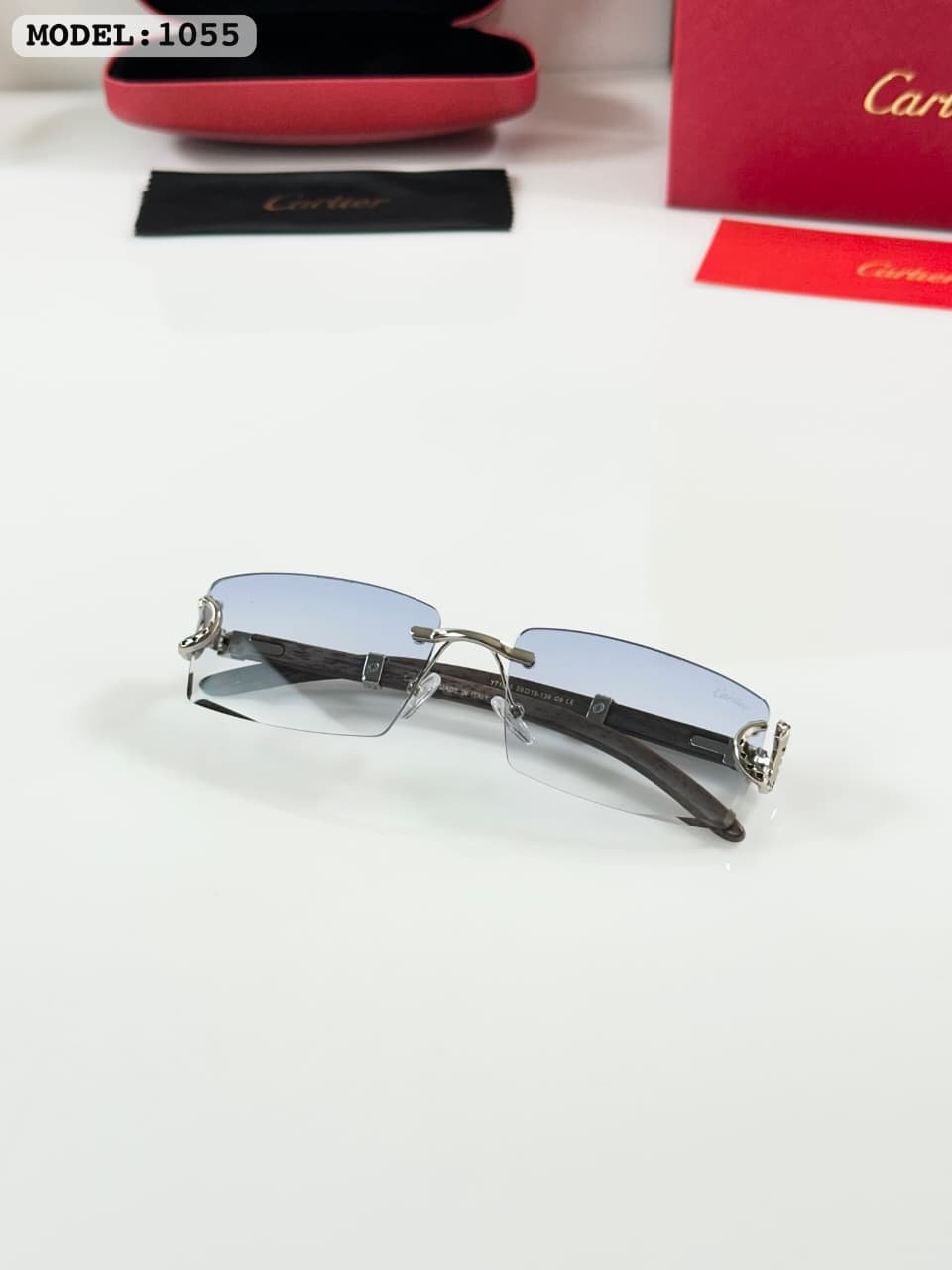 Silver Rimless Sunglasses – Blue Gradient Lenses (3) Silver rimless sunglasses with rectangular light blue tinted lenses