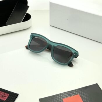 Teal rectangular sunglasses with dark grey lenses and brown patterned temples