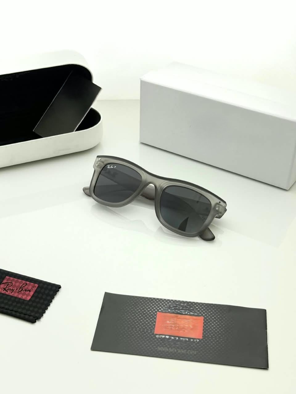 Transparent Grey Sunglasses – Dark Grey Lenses (4) Transparent grey sunglasses with dark grey lenses and softly squared frames