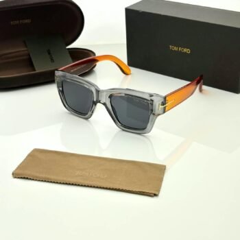 Transparent grey square sunglasses with dark gradient lenses and orange temple accents