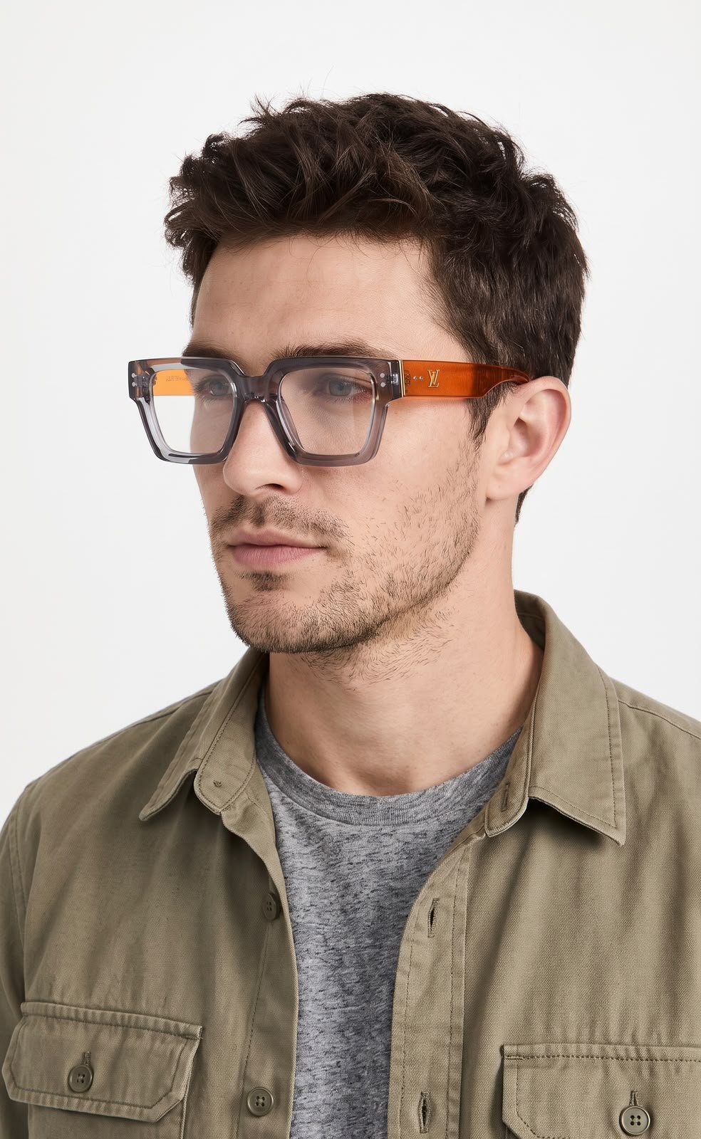 Transparent Square Glasses – Grey Frame with Orange Temples (4) Transparent smoky grey square glasses with bright orange temples and clear-looking lenses